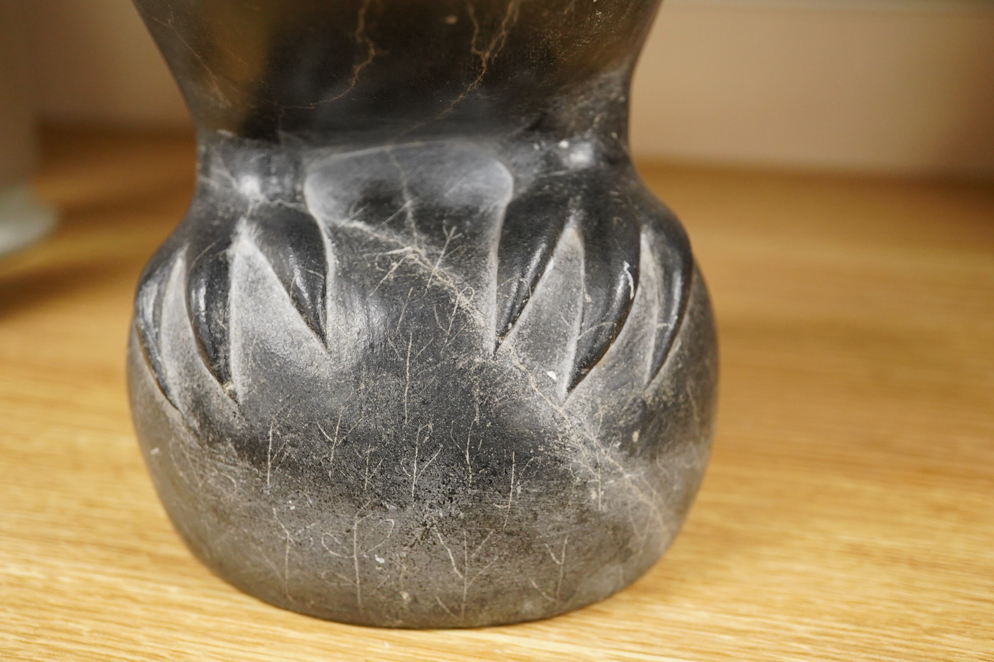 An Inuit stone carving of a falcon by Isapik, 18cm high